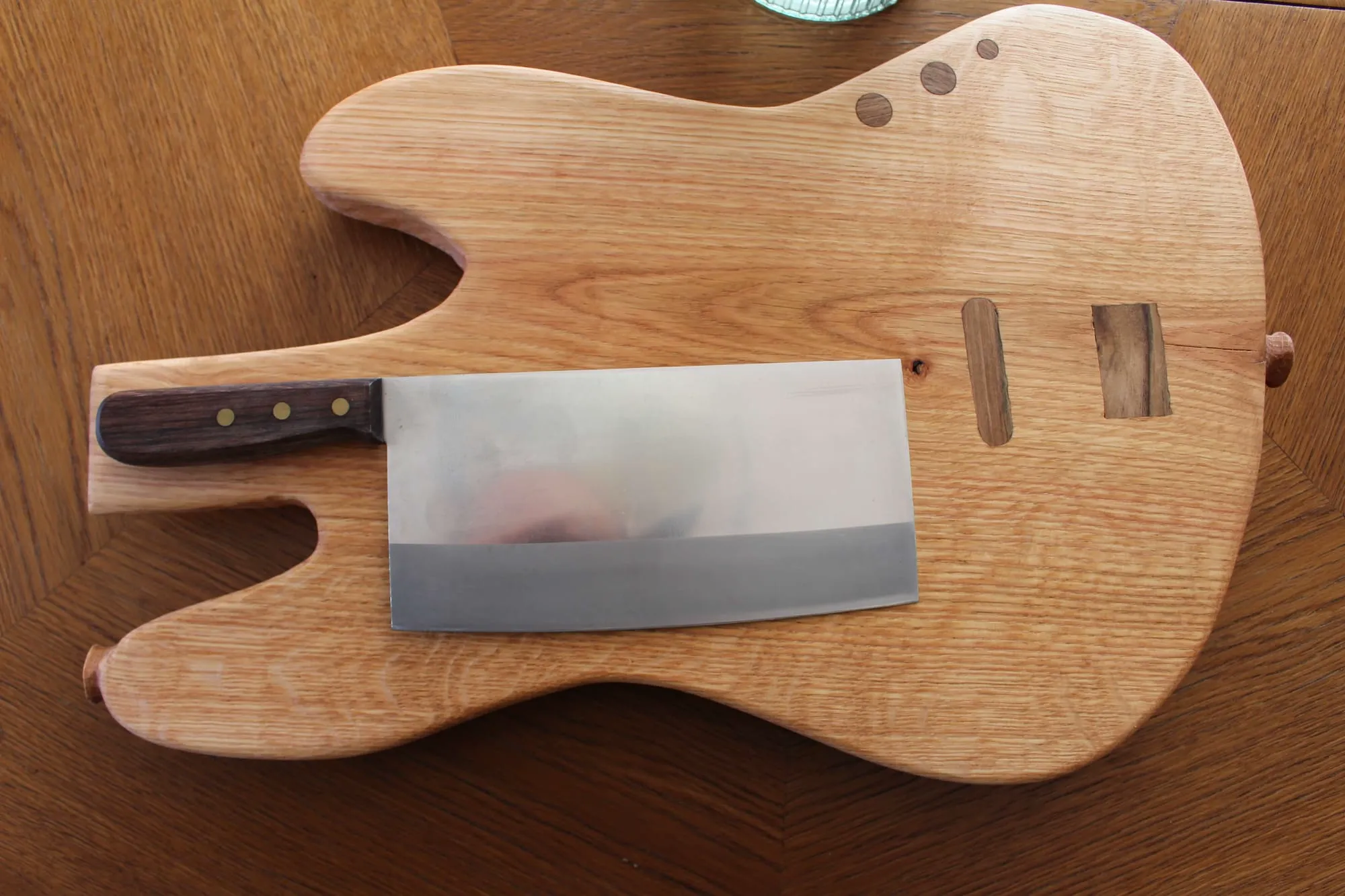 Jazz Bass cutting board — oak body shaped like a guitar